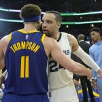 
              Memphis Grizzlies forward Dillon Brooks, right, congratulates Golden State Warriors guard Klay Thompson (11) at the end of Game 6 of an NBA basketball Western Conference playoff semifinal in San Francisco, Friday, May 13, 2022. The Warriors won 110-96, advancing to the conference finals. (AP Photo/Tony Avelar)
            