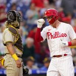 
              Philadelphia Phillies' Rhys Hoskins, right, reacts after hitting a home run against San Diego Padres pitcher Blake Snell during the third inning of a baseball game, Wednesday, May 18, 2022, in Philadelphia. (AP Photo/Matt Slocum)
            