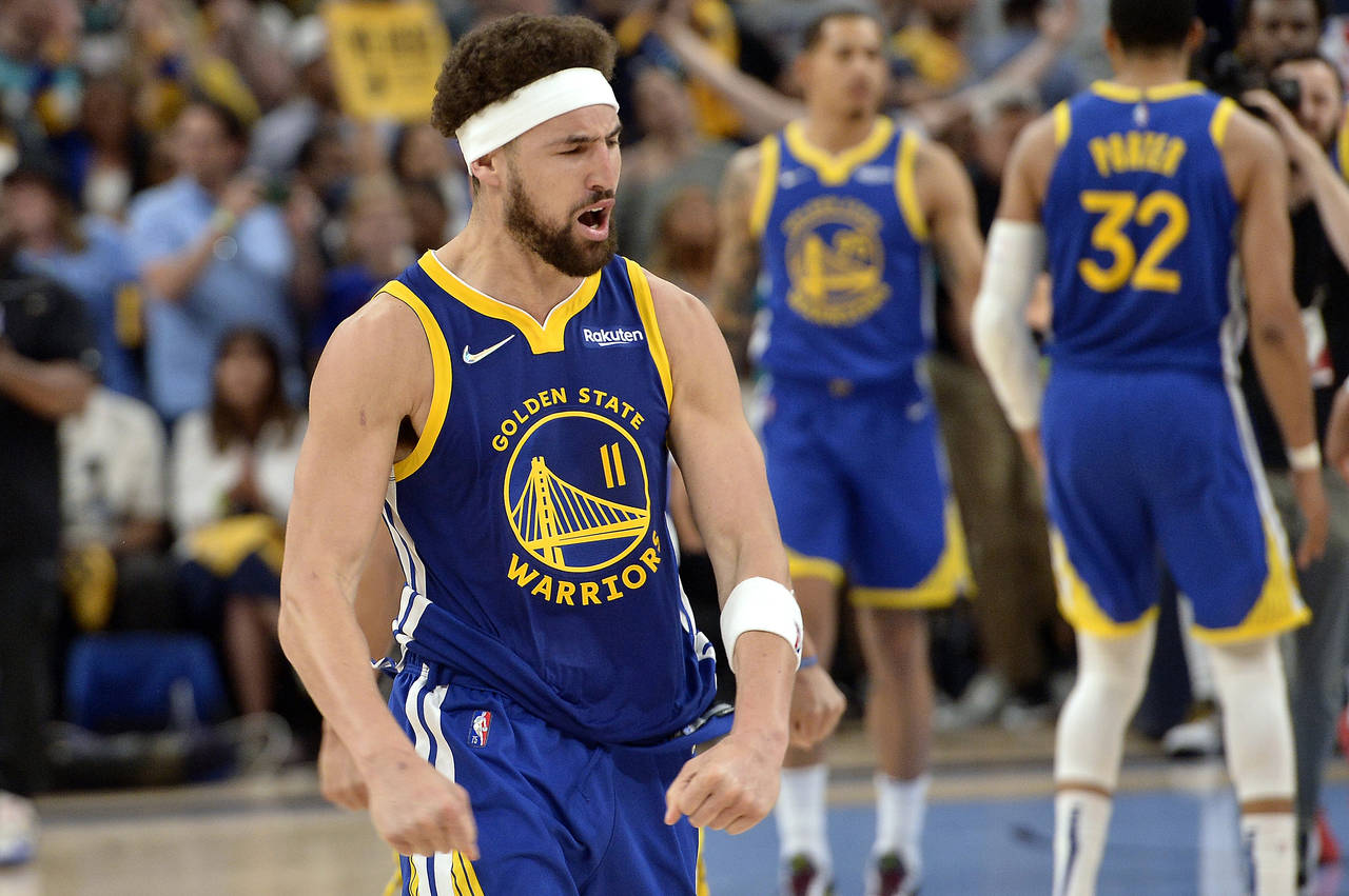 Golden State Warriors guard Klay Thompson (11) reacts after a win over the Memphis Grizzlies during...