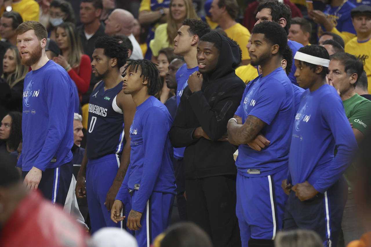 Dallas Mavericks players watch from the bench area during the second half of Game 2 of the NBA bask...