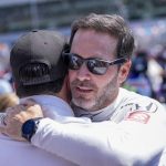 
              Driver Jimmie Johnson, right, gets a hug before the Indianapolis 500 auto race at Indianapolis Motor Speedway in Indianapolis, Sunday, May 29, 2022. (AP Photo/AJ Mast)
            