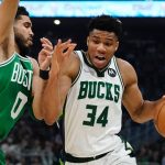 
              Milwaukee Bucks' Giannis Antetokounmpo gets past Boston Celtics' Jayson Tatum during the first half of Game 3 of an NBA basketball Eastern Conference semifinals playoff series Saturday, May 7, 2022, in Milwaukee. (AP Photo/Morry Gash)
            