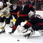 
              Boston Bruins' Curtis Lazar (20) tries to control the puck in front of Carolina Hurricanes goaltender Pyotr Kochetkov (52) during the third period of Game 2 of an NHL hockey Stanley Cup first-round playoff series in Raleigh, N.C., Wednesday, May 4, 2022. (AP Photo/Karl B DeBlaker)
            