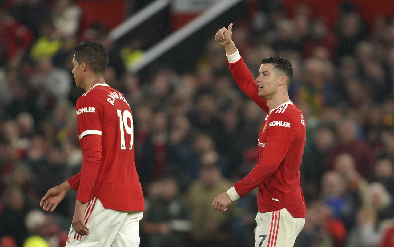 Manchester United's Cristiano Ronaldo, right, reacts during the English Premier League soccer match...
