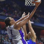
              Los Angeles Sparks center Liz Cambage (1) scores over Connecticut Sun center Brionna Jones (42) during a WNBA basketball game Saturday, May 14, 2022, in Uncasville, Conn. (Sean D. Elliot/The Day via AP)
            
