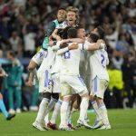 
              Real Madrid players celebrate at the end of the Champions League semi final, second leg soccer match between Real Madrid and Manchester City at the Santiago Bernabeu stadium in Madrid, Spain, Wednesday, May 4, 2022. (AP Photo/Manu Fernandez)
            