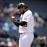
              Colorado Rockies starting pitcher German Marquez reacts after giving up a two-run double to New York Mets' Patrick Mazeika in the second inning of the first baseball game of a doubleheader, Saturday, May 21 2022, in Denver. (AP Photo/David Zalubowski)
            