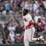 
              Atlanta Braves' Marcell Ozuna (20) celebrates after hitting a two-run home run in the eighth inning of a baseball game against the San Diego Padres, Saturday, May 14, 2022, in Atlanta. (AP Photo/Brynn Anderson)
            