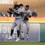 
              Pittsburgh Pirates outfielders Jake Marisnick, left, Bryan Reynolds, center, and Ben Gamel celebrate after the Pirates' 7-2 win over the Detroit Tigers in the second baseball game of a doubleheader, Wednesday, May 4, 2022, in Detroit. (AP Photo/Carlos Osorio)
            