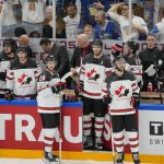 
              Team Canada looks on as Team Finland celebrates victory during the Hockey World Championship final match between Finland and Canada, Sunday May 29, 2022, in Tampere, Finland. Finland won 4-3 in overtime. (AP Photo/Martin Meissner)
            