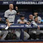 
              Miami Marlins' Jacob Stallings, second from left, screams at umpires after it was ruled that a fly ball by Jorge Soler went foul during the eighth inning of a baseball game against the Tampa Bay Rays Wednesday, May 25, 2022, in St. Petersburg, Fla. (AP Photo/Chris O'Meara)
            