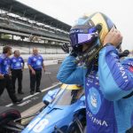 
              Jimmie Johnson takes off his helmet during qualifications for the Indianapolis 500 auto race at Indianapolis Motor Speedway, Saturday, May 21, 2022, in Indianapolis. (AP Photo/Darron Cummings)
            