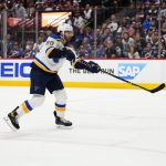 
              St. Louis Blues left wing Brandon Saad (20) scores an empty-net goal against the Colorado Avalanche during the third period in Game 2 of an NHL hockey Stanley Cup second-round playoff series Thursday, May 19, 2022, in Denver. The Blues won 4-1. (AP Photo/Jack Dempsey)
            