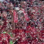
              Liverpool's Jordan Henderson lifts the trophy and celebrates after winning the English FA Cup final soccer match between Chelsea and Liverpool, at Wembley stadium, in London, Saturday, May 14, 2022.  (AP Photo/Kirsty Wigglesworth)
            