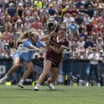 
              Boston College midfielder Kayla Martello (38) attempts to run at the goal during the NCAA college Division 1 women's lacrosse championship against North Carolina in Baltimore, Sunday, May 29, 2022. (Vincent Alban/The Baltimore Sun via AP)
            