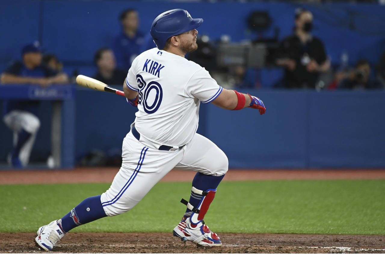 Toronto Blue Jays' Alejandro Kirk watches his two-run home run against the Chicago White Sox during...