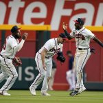 
              Atlanta Braves players, from left, Marcell Ozuna, Adam Duvall and Travis Demeritte celebrate after defeating the San Diego Padres in a baseball game, Saturday, May 14, 2022, in Atlanta. (AP Photo/Brynn Anderson)
            