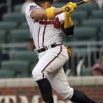 
              Atlanta Braves' William Contreras hits a double in the first inning of a baseball game against the Philadelphia Phillies, Monday, May 23, 2022, in Atlanta. (AP Photo/John Bazemore)
            