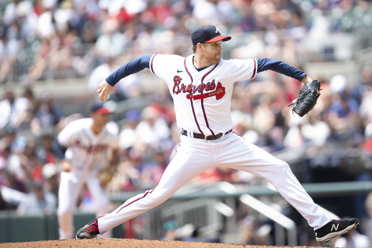 Atlanta Braves relief pitcher Collin McHugh (32) throws during the seventh inning of a baseball gam...