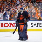 
              Edmonton Oilers goalie Mike Smith returns to the ice during third period NHL second round playoff hockey action against the Calgary Flames in Edmonton, Alberta, Sunday, May 22, 2022. (Jeff McIntosh/The Canadian Press via AP)
            