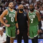 
              Boston Celtics head coach Ime Udoka speaks to Boston Celtics forward Jayson Tatum (0) and guard Jaylen Brown (7) during the second half of Game 1 of an NBA basketball Eastern Conference finals playoff series against the Miami Heat, Tuesday, May 17, 2022, in Miami. (AP Photo/Lynne Sladky)
            