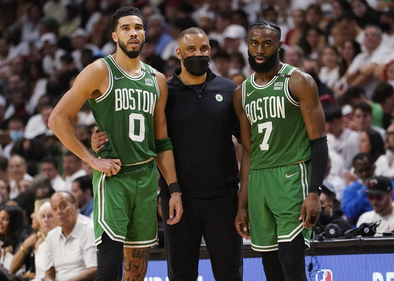 Boston Celtics head coach Ime Udoka speaks to Boston Celtics forward Jayson Tatum (0) and guard Jay...