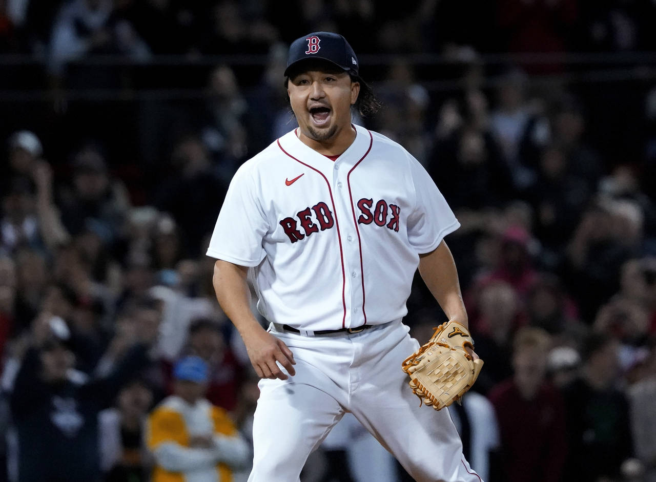 Boston Red Sox pitcher Hirokazu Sawamura reacts after striking out Los Angeles Angels' Shohei Ohtan...