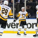 
              Pittsburgh Penguins' Jake Guentzel (59) celebrates with teammates Bryan Rust (17) and Marcus Pettersson (28) after scoring a goal during the first period of Game 2 of an NHL hockey Stanley Cup first-round playoff series against the New York Rangers, Thursday, May 5, 2022, in New York. (AP Photo/Frank Franklin II)
            