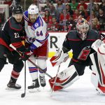 
              Carolina Hurricanes goaltender Antti Raanta (32) watches the puck as Brett Pesce (22) defends against New York Rangers' Tyler Motte (64) during the first period of Game 1 of an NHL hockey Stanley Cup second-round playoff series in Raleigh, N.C., Wednesday, May 18, 2022. (AP Photo/Karl B DeBlaker)
            
