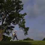 
              Justin Thomas and Dustin Johnson walk on the 13th hole during the second round of the PGA Championship golf tournament at Southern Hills Country Club, Friday, May 20, 2022, in Tulsa, Okla. (AP Photo/Matt York)
            