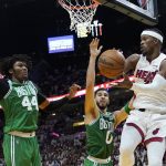 
              Boston Celtics center Robert Williams III (44) and forward Jayson Tatum (0) attempt to block a pass by Miami Heat forward Jimmy Butler (22) during the second half of Game 1 of an NBA basketball Eastern Conference finals playoff series, Tuesday, May 17, 2022, in Miami. (AP Photo/Lynne Sladky)
            