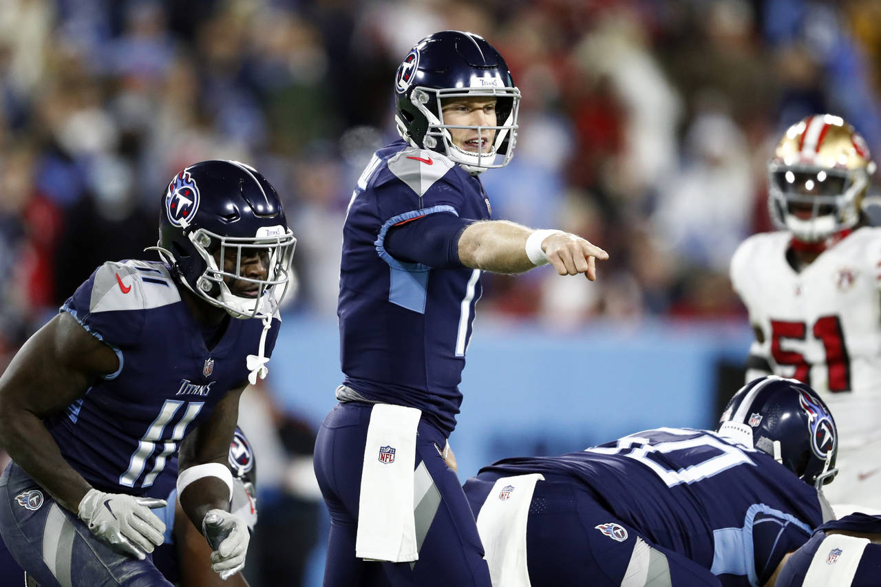 FILE - Tennessee Titans quarterback Ryan Tannehill calls a play as wide receiver A.J. Brown (11) is...
