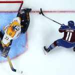 
              Colorado Avalanche center Andrew Cogliano (11) scores against Nashville Predators goaltender David Rittich (33) during the first period in Game 1 of an NHL hockey Stanley Cup first-round playoff series Tuesday, May 3, 2022, in Denver. (AP Photo/Jack Dempsey)
            