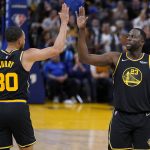 
              Golden State Warriors guard Stephen Curry (30) celebrates with forward Draymond Green (23) during the second half of Game 3 of the team's NBA basketball Western Conference playoff semifinal against the Memphis Grizzlies in San Francisco, Saturday, May 7, 2022. (AP Photo/Jeff Chiu)
            