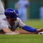 
              New York Mets' Pete Alonso slides into third base to advance on a fly out by Mark Canha during the second inning of a baseball game against the Philadelphia Phillies, Thursday, May 5, 2022, in Philadelphia. (AP Photo/Matt Slocum)
            