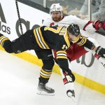 
              Boston Bruins' Nick Foligno, front, collides with Carolina Hurricanes' Ian Cole, behind, in the first period of Game 4 of an NHL hockey Stanley Cup first-round playoff series, Sunday, May 8, 2022, in Boston. (AP Photo/Steven Senne)
            