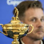 
              2023 Europe Ryder Cup golf captain Henrik Stenson looks at the Ryder Cup Trophy during a press conference, at the Marco Simone golf club, in Guidonia Montecelio, outskirts of Rome, Monday, May 30, 2022. (AP Photo/Andrew Medichini)
            