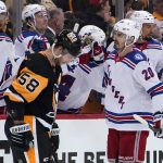 
              New York Rangers' Chris Kreider (20) returns to the bench after scoring against the Pittsburgh Penguins during the second period in Game 6 of an NHL hockey Stanley Cup first-round playoff series in Pittsburgh, Friday, May 13, 2022. (AP Photo/Gene J. Puskar)
            
