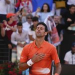 
              Serbia's Novak Djokovic celebrates after winning his final match against Greece's Stefanos Tsitsipas at the Italian Open tennis tournament, in Rome, Sunday, May 15, 2022. (AP Photo/Alessandra Tarantino)
            