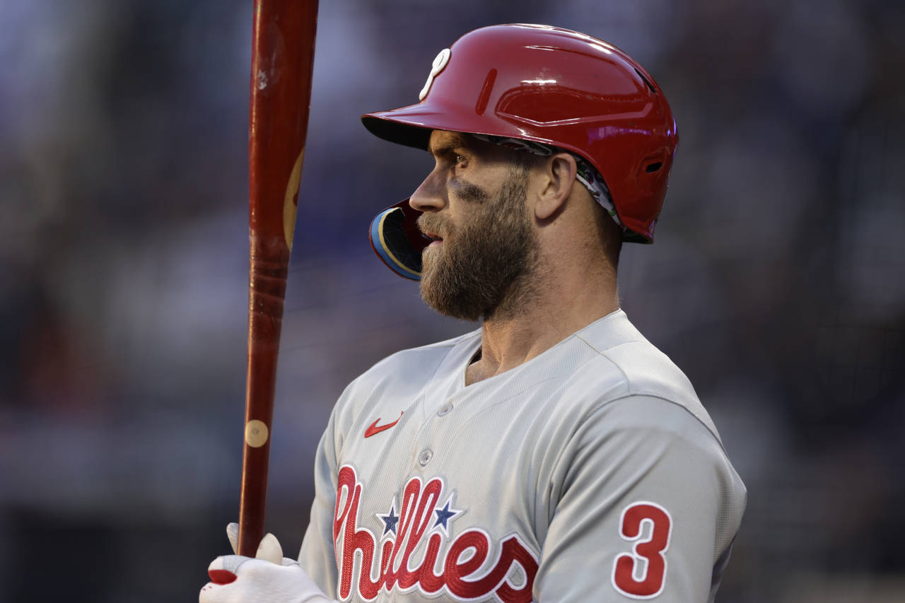 Philadelphia Phillies' Bryce Harper stands in the on-deck circle during the first inning of the tea...
