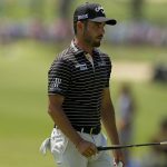
              Abraham Ancer, of Mexico, walks off the green on the 13th hole during the first round of the PGA Championship golf tournament, Thursday, May 19, 2022, in Tulsa, Okla. (AP Photo/Eric Gay)
            