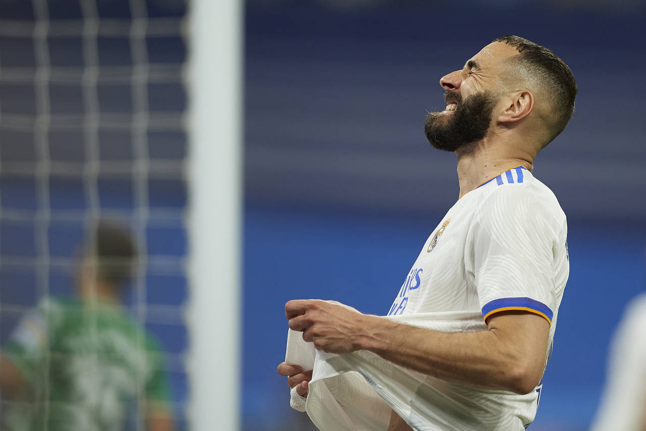 Real Madrid's Karim Benzema reacts after missing a chance during a Spanish La Liga soccer match bet...