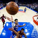 
              Philadelphia 76ers' Tobias Harris (12) goes up for a shot against Miami Heat's Kyle Lowry during the first half of Game 3 of an NBA basketball second-round playoff series, Friday, May 6, 2022, in Philadelphia. (AP Photo/Matt Slocum)
            
