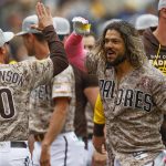 
              San Diego Padres' Jose Alfaro, front right, celebrates with bench coach Ryan Christenson after hitting a three-run walkoff home run against the Miami Marlins during the ninth inning of a baseball game Sunday, May 8, 2022, in San Diego. (AP Photo/Mike McGinnis)
            