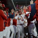 
              St. Louis Cardinals' Paul Goldschmidt (46) celebrates in the dugout after hitting a two-run home run during the third inning of a baseball game against the Milwaukee Brewers on Friday, May 27, 2022, in St. Louis. (AP Photo/Michael B. Thomas)
            