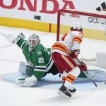
              Calgary Flames left wing Johnny Gaudreau (13) scores on a penalty shot on Dallas Stars goaltender Jake Oettinger (29) in the third period of Game 4 of an NHL hockey Stanley Cup first-round playoff series, Monday, May 9, 2022, in Dallas. (AP Photo/Tony Gutierrez)
            
