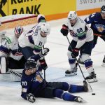 
              Finland's Teemu Hartikanen falls to the ice during a match between Finland and the the United States in the semifinals of the Hockey World Championships, in Tampere, Finland, Saturday, May 28, 2022. (AP Photo/Martin Meissner)
            