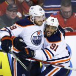 
              Edmonton Oilers center Leon Draisaitl, left, celebrates his goal against the Calgary Flames with Evander Kane during the third period of Game 2 of an NHL hockey Stanley Cup playoffs second-round series Friday, May 20, 2022, in Calgary, Alberta. (Jeff McIntosh/The Canadian Press via AP)
            