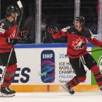 
              Canada's Kent Johnson, right, celebrates his goal during a match between the Czech Republic and Canada in the semifinals of the Hockey World Championships, in Tampere, Finland, Saturday, May 28, 2022. (AP Photo/Martin Meissner)
            