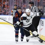 
              Los Angeles Kings center Phillip Danault, right, is checked by Edmonton Oilers right wing Jesse Puljujarvi during the first period in Game 7 of a first-round series in the NHL hockey Stanley Cup playoffs Saturday, May 14, 2022, in Edmonton, Alberta. (Jeff McIntosh/The Canadian Press via AP)
            